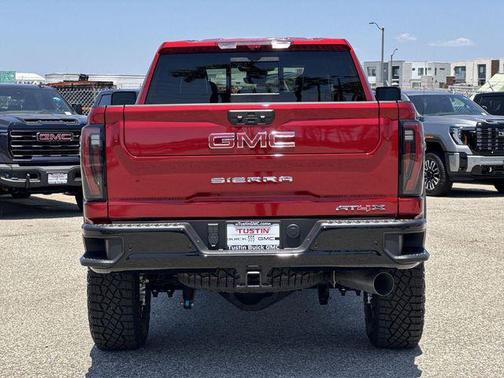 Volcanic Red Tintcoat 2026 GMC Sierra 2500 AT4X