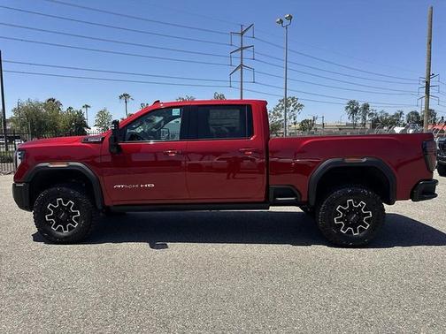 Volcanic Red Tintcoat 2026 GMC Sierra 2500 AT4X