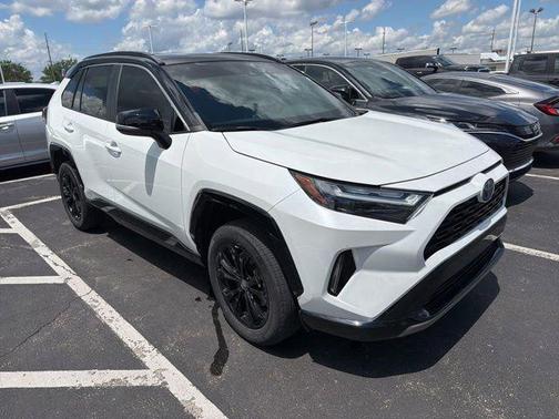 Wind Chill Pearl/Midnight Black Metallic 2023 Toyota RAV4 Hybrid SE