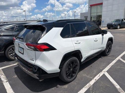 Wind Chill Pearl/Midnight Black Metallic 2023 Toyota RAV4 Hybrid SE