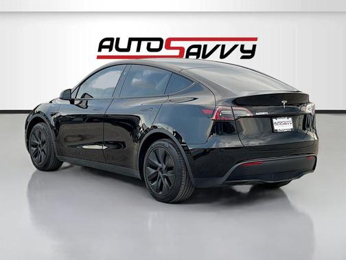 Solid Black 2025 Tesla Model Y Long Range Dual Motor Rear-Wheel Drive