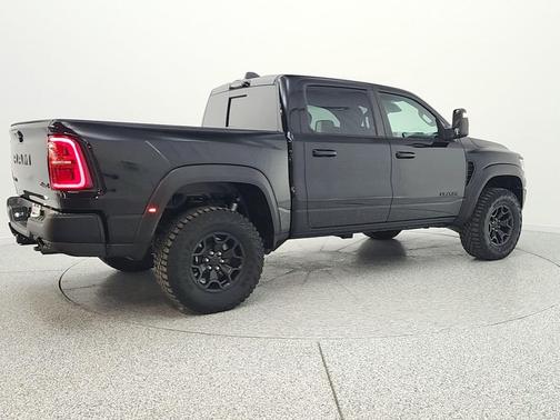Diamond Black Crystal Pearlcoat 2025 RAM 1500 RHO Crew Cab 4x4 5'7' Box