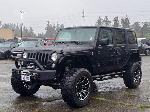 Black 2016 Jeep Wrangler Unlimited Sport