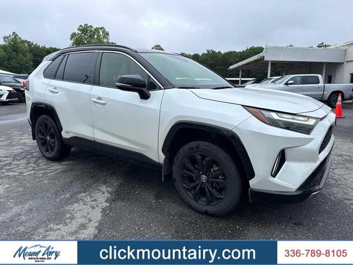 Wind Chill Pearl/Midnight Black Metallic 2023 Toyota RAV4 Hybrid SE