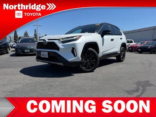 Wind Chill Pearl/Midnight Black Metallic 2023 Toyota RAV4 Hybrid SE