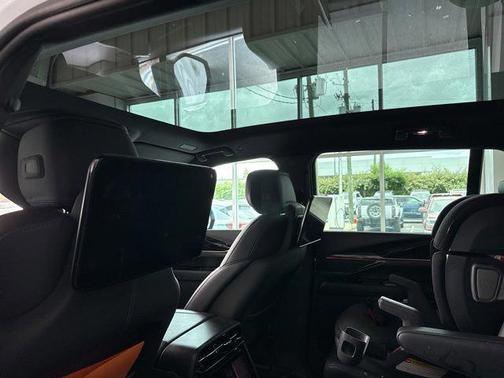 White 2025 Cadillac Escalade IQ Sport 1