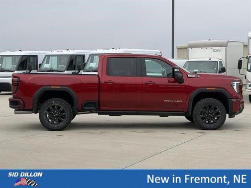 Volcanic Red Tintcoat 2026 GMC Sierra 2500 AT4