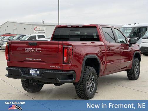 Volcanic Red Tintcoat 2026 GMC Sierra 1500 AT4X