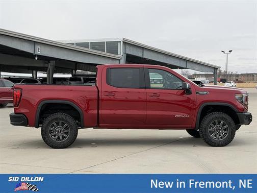 Volcanic Red Tintcoat 2026 GMC Sierra 1500 AT4X