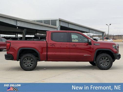 Volcanic Red Tintcoat 2026 GMC Sierra 1500 AT4X