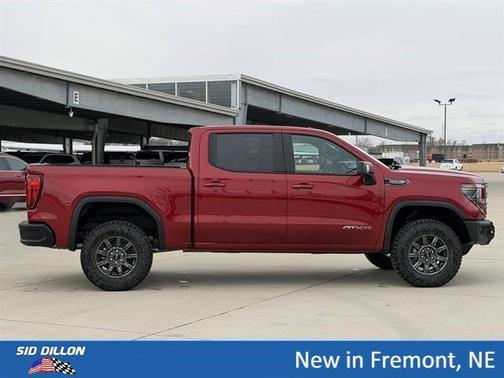 Volcanic Red Tintcoat 2026 GMC Sierra 1500 AT4X