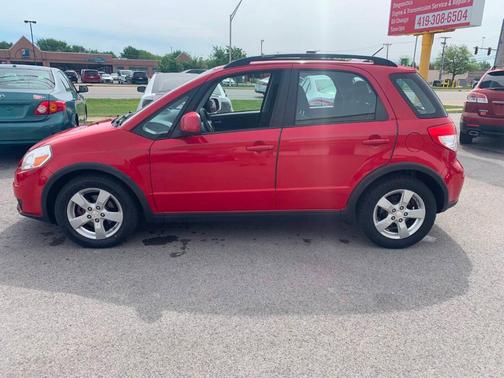 Red 2011 Suzuki SX4 Base
