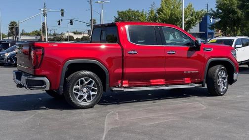 Volcanic Red Tintcoat 2026 GMC Sierra 1500 SLT