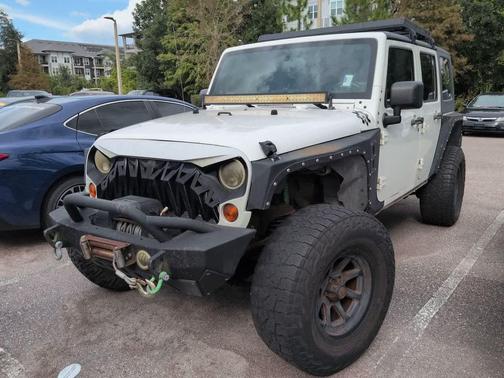 Stone White 2010 Jeep Wrangler Unlimited Sahara