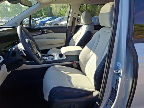 Ivory Silver 2026 Kia Carnival Hybrid SX Prestige