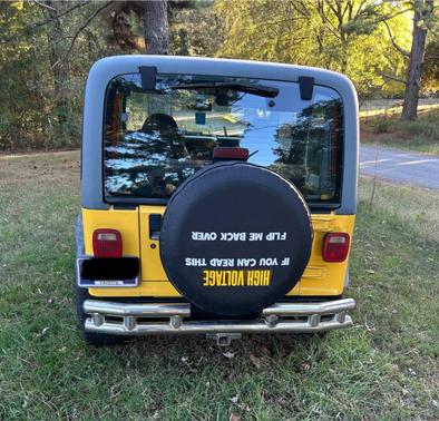 Yellow 2000 Jeep Wrangler Sport