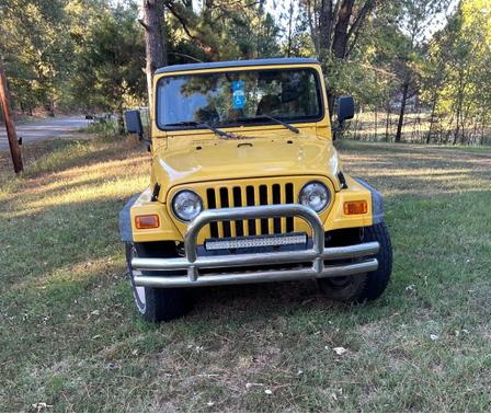 Yellow 2000 Jeep Wrangler Sport