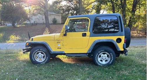 Yellow 2000 Jeep Wrangler Sport