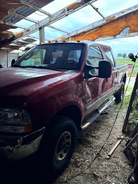 Red 2003 Ford F-250 XLT Crew Cab Super Duty