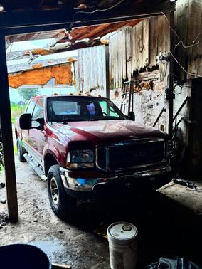 Red 2003 Ford F-250 XLT Crew Cab Super Duty