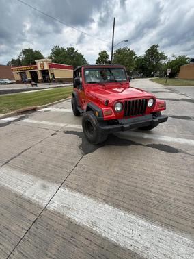 Red 1997 Jeep Wrangler SE