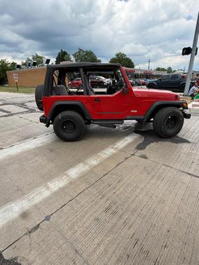 Red 1997 Jeep Wrangler SE