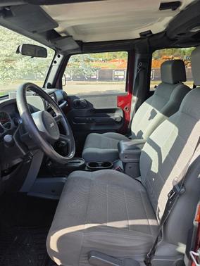 Red 2007 Jeep Wrangler Unlimited Sahara