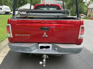Red 2009 Mitsubishi Raider LS Extended Cab