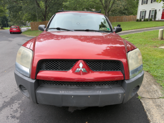 Red 2009 Mitsubishi Raider LS Extended Cab