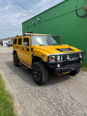 Yellow 2003 Hummer H2 Base