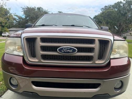 Red 2006 Ford F-150 King Ranch SuperCrew