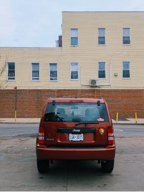 Red 2009 Jeep Liberty Sport