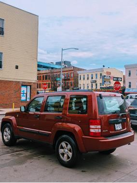 Red 2009 Jeep Liberty Sport