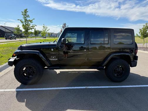Black 2016 Jeep Wrangler Unlimited Sahara