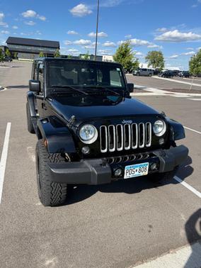 Black 2016 Jeep Wrangler Unlimited Sahara