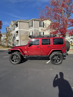 Red 2013 Jeep Wrangler Unlimited Sahara