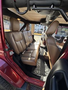 Red 2013 Jeep Wrangler Unlimited Sahara