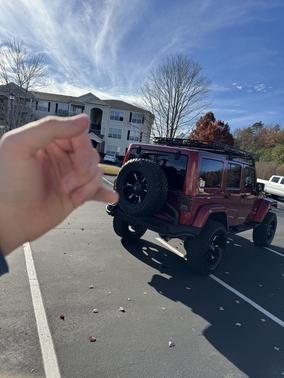 Red 2013 Jeep Wrangler Unlimited Sahara