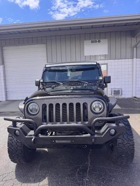 Black 2014 Jeep Wrangler Unlimited Sport