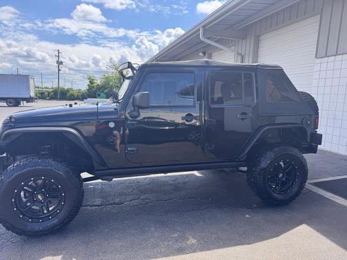 Black 2014 Jeep Wrangler Unlimited Sport