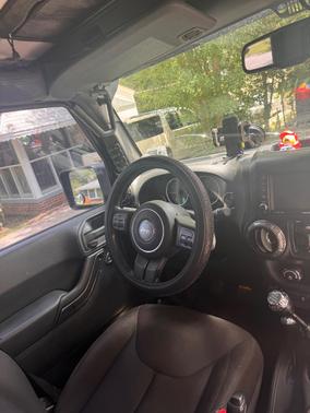 Black 2014 Jeep Wrangler Unlimited Sport