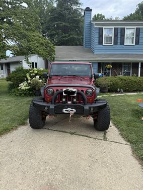 Red 2013 Jeep Wrangler Unlimited Sahara