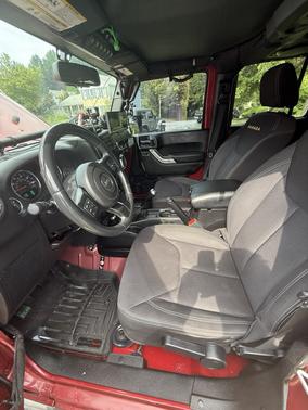 Red 2013 Jeep Wrangler Unlimited Sahara