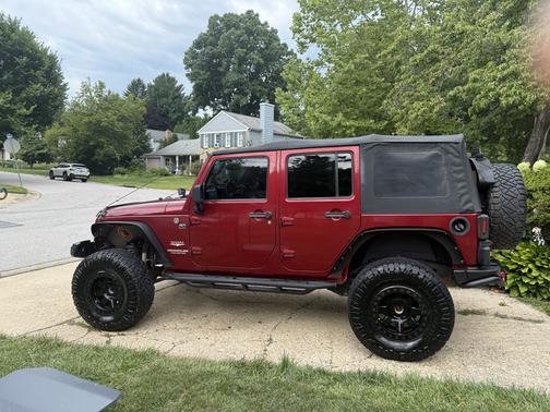 Red 2013 Jeep Wrangler Unlimited Sahara