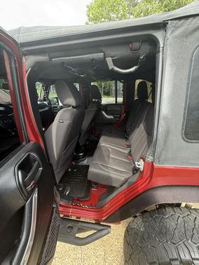 Red 2013 Jeep Wrangler Unlimited Sahara