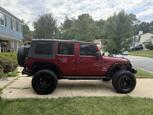 Red 2013 Jeep Wrangler Unlimited Sahara