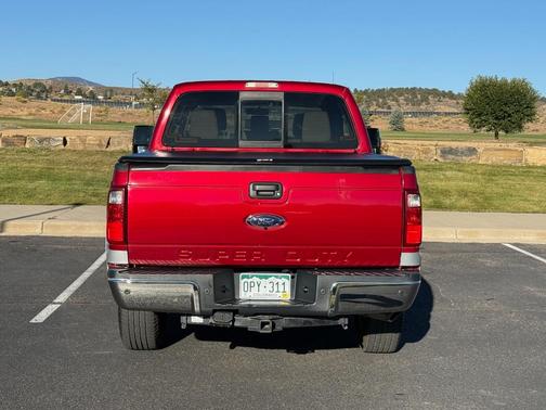 Red 2014 Ford F-250 Lariat