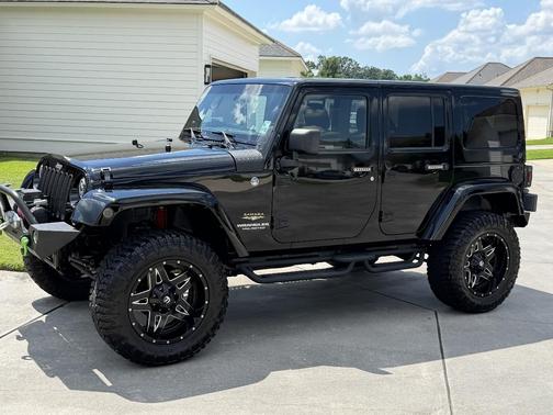 Black 2012 Jeep Wrangler Unlimited Sahara