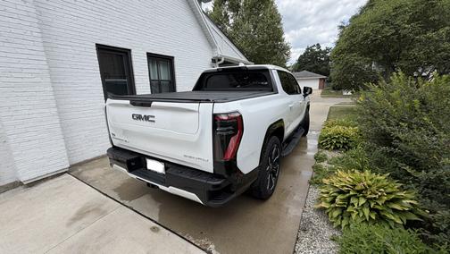 White 2025 GMC Sierra EV Max Range Denali
