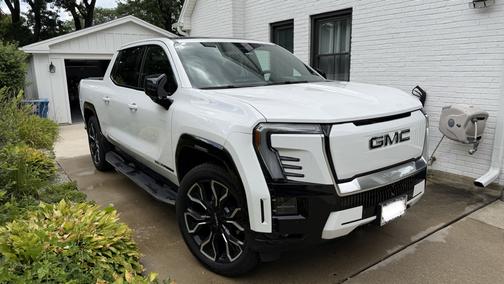 White 2025 GMC Sierra EV Max Range Denali